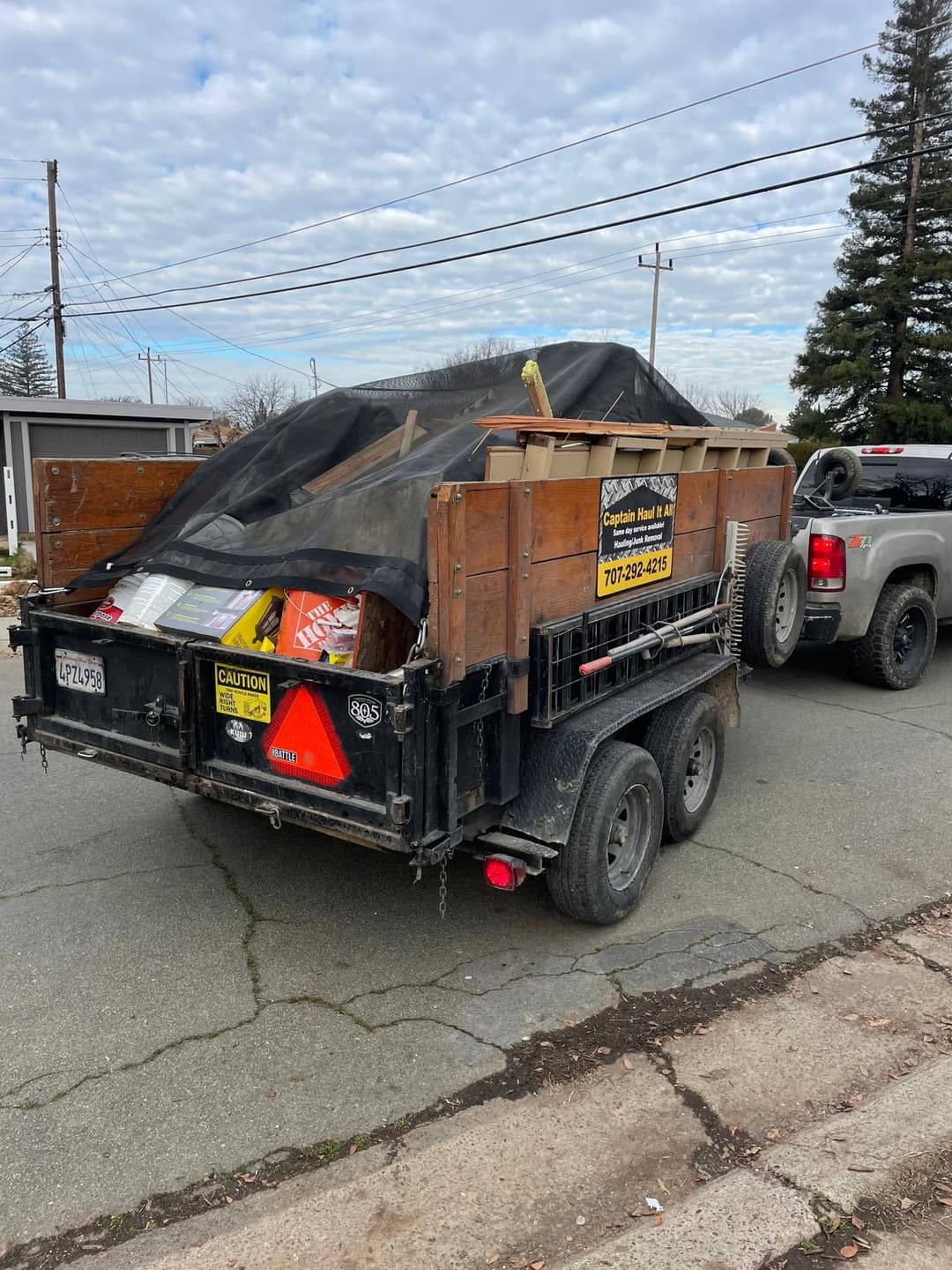 picture of a dumpster trailer full of junk