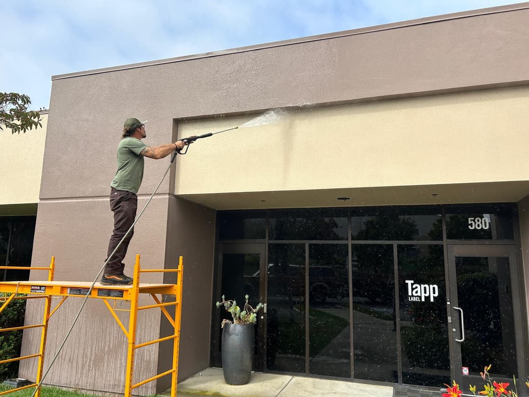 picture of a commercial building being pressure washed