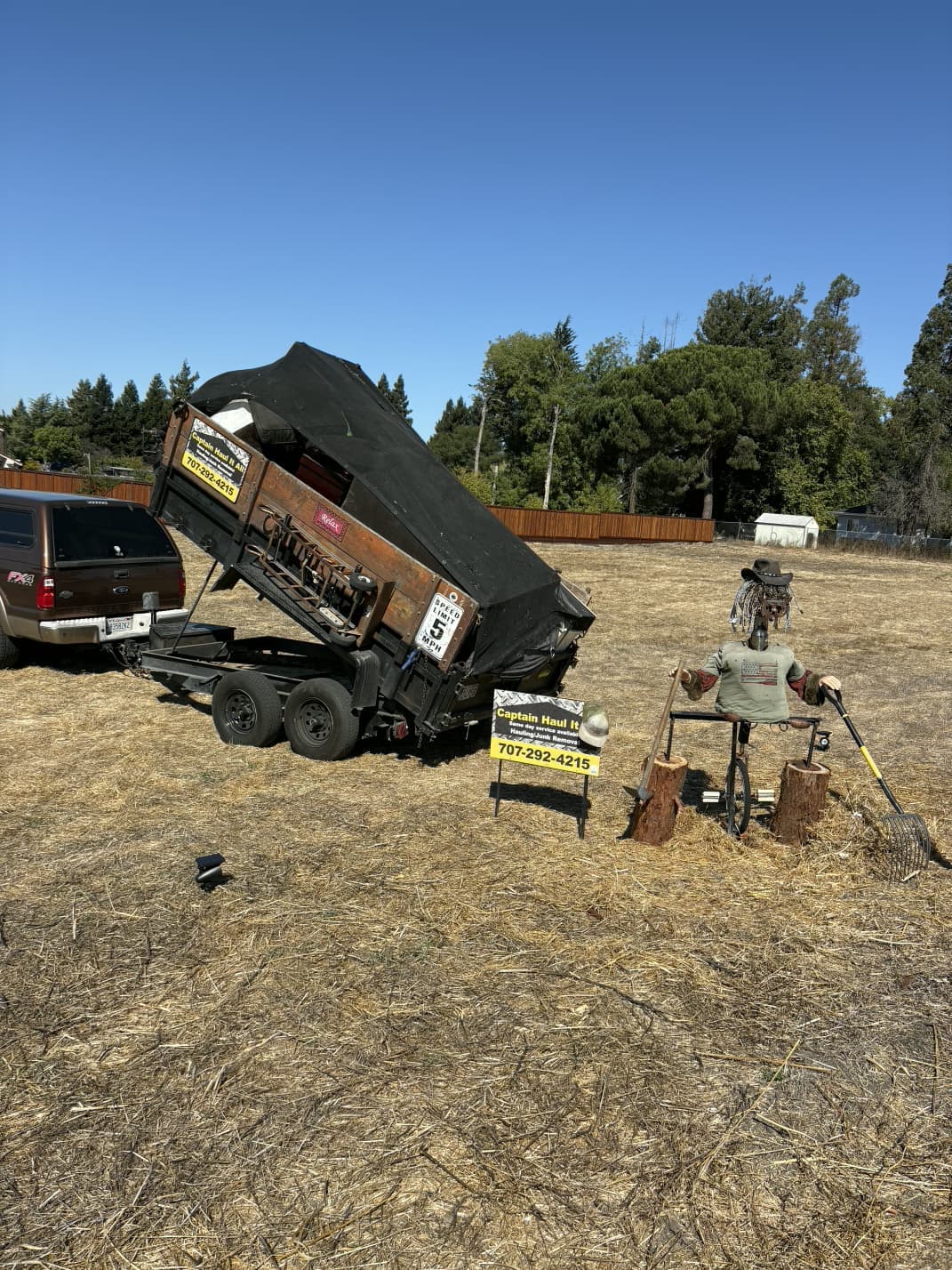 Dump trailer loaded with debris and materials during hauling project.